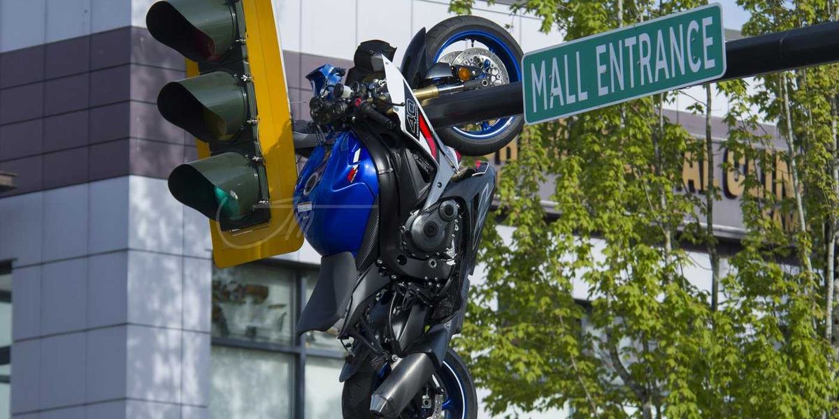 Crash leaves motorcycle hanging from traffic light