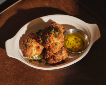 Crispy, cheesy cheddar biscuits with butter sauce